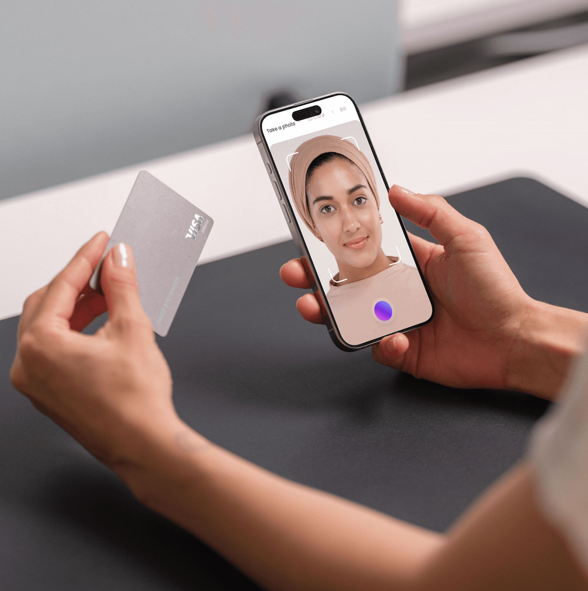 Person verifying identity by scanning ID with phone